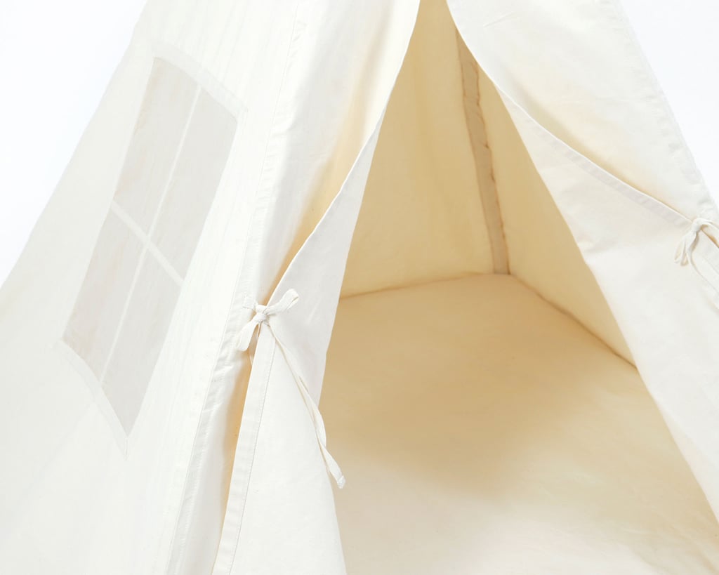 close up of a kids teepee tent in full view, wit the curtains open