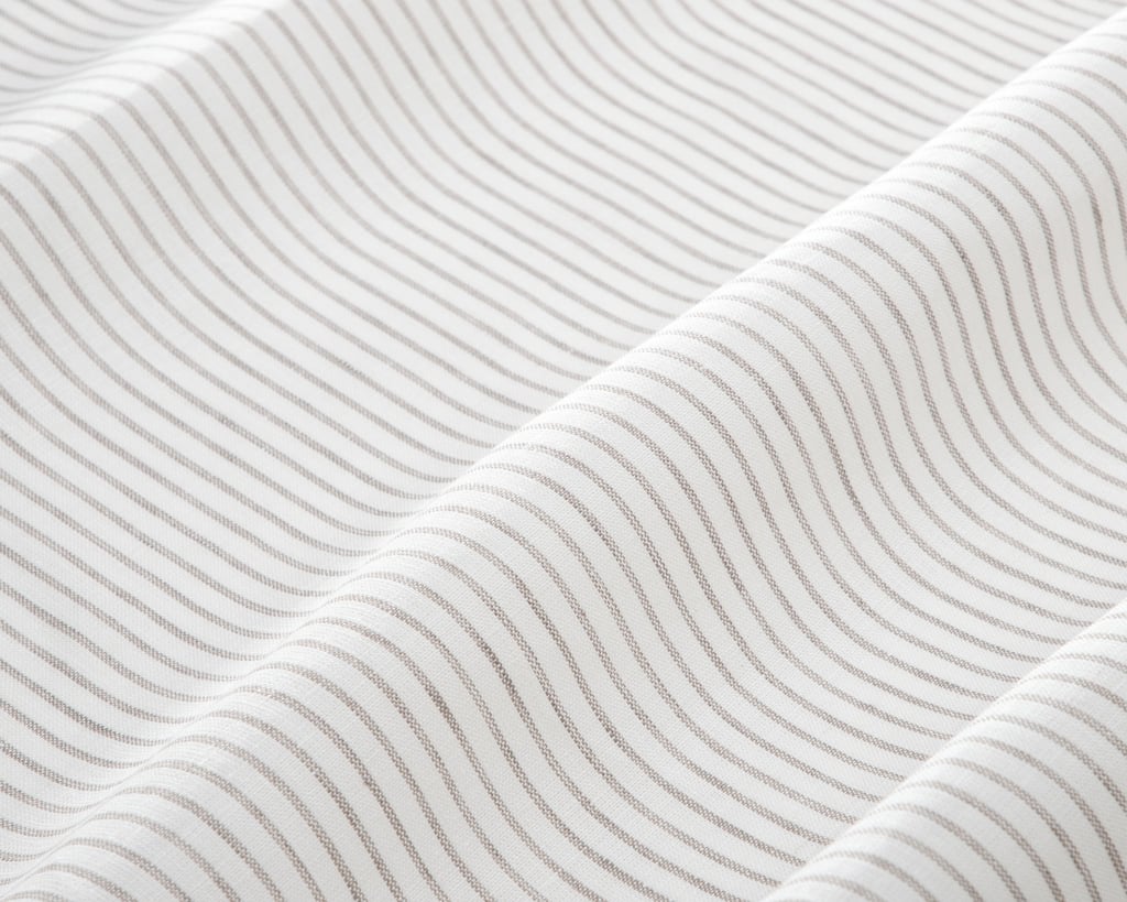 linen fabric with thin grey stripes close up