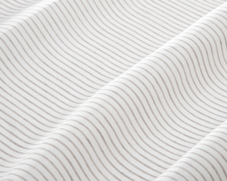 linen fabric with thin grey stripes close up