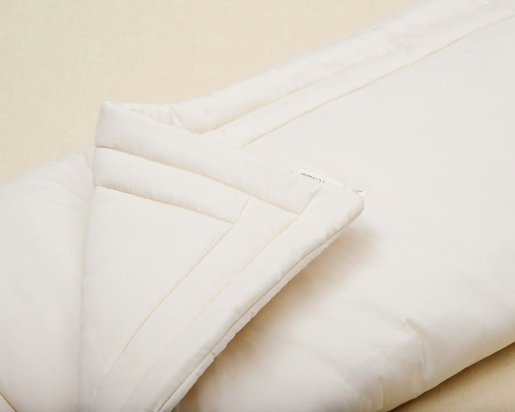 hogar de edredón de lana doblado