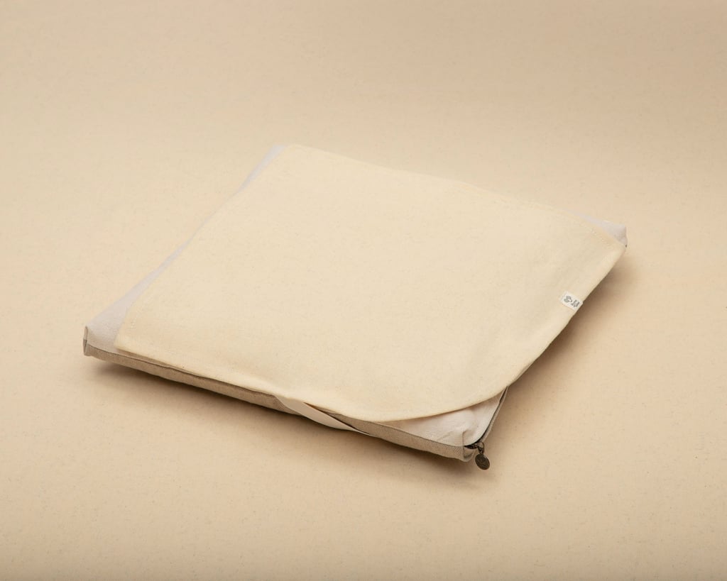 wool mattress protector on top of a mattress topper sample, flat