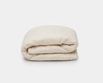 couples wool duvet folded on a white background. Big wool duvet
