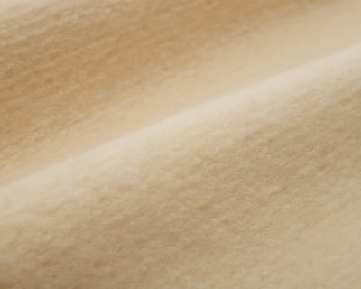 close up of karakul wool fabric by home of wool