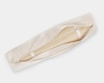 wool yoga mat rolled up in a carry bag