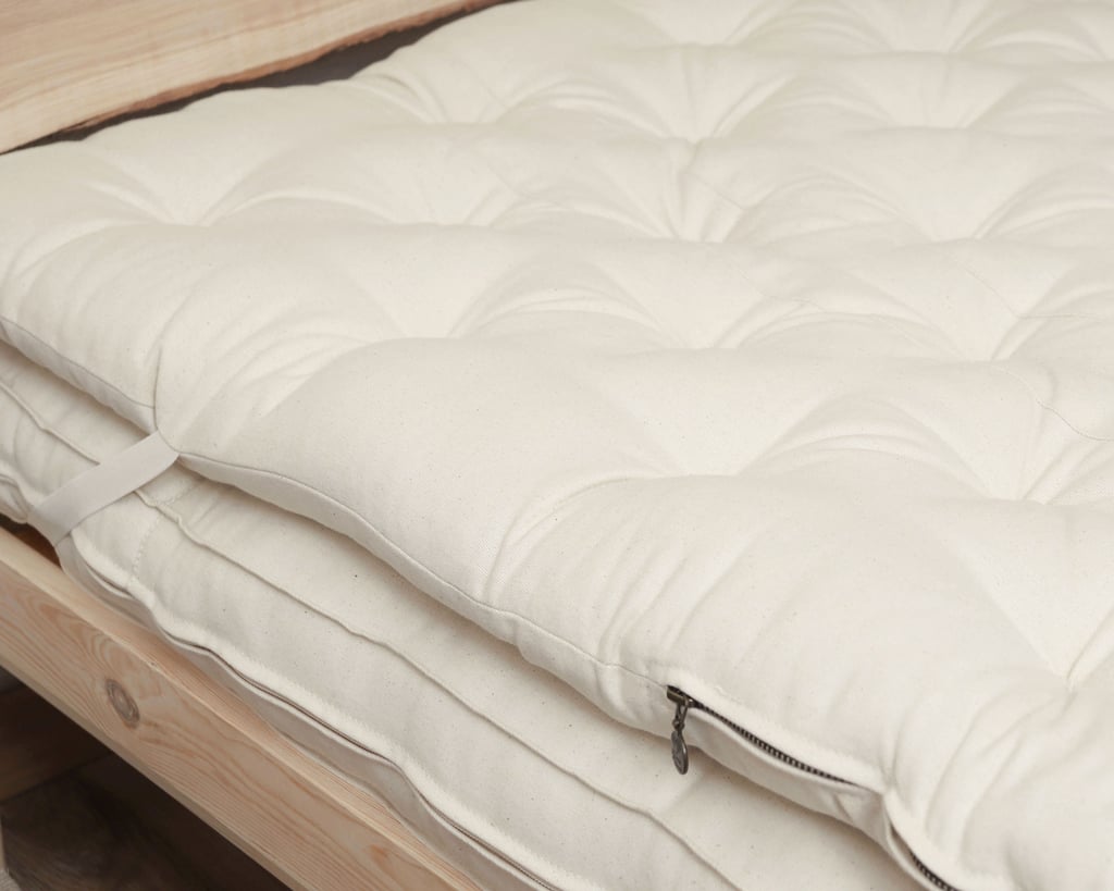 zero waste mattress topper showing zipper and elastic straps